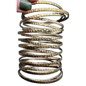 Slinky style hammered coil bangle bracelet one piece gold tone